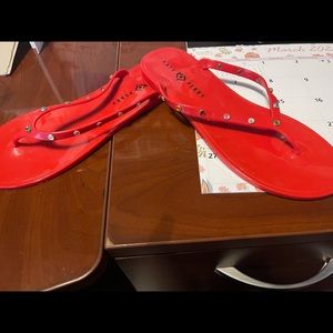 Red rhinestone encrusted sandals by Katy Perry. New without tags